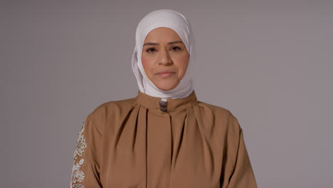 Studio-Head-And-Shoulders-Portrait-Of-Muslim-Woman-Wearing-Hijab-Praying-6